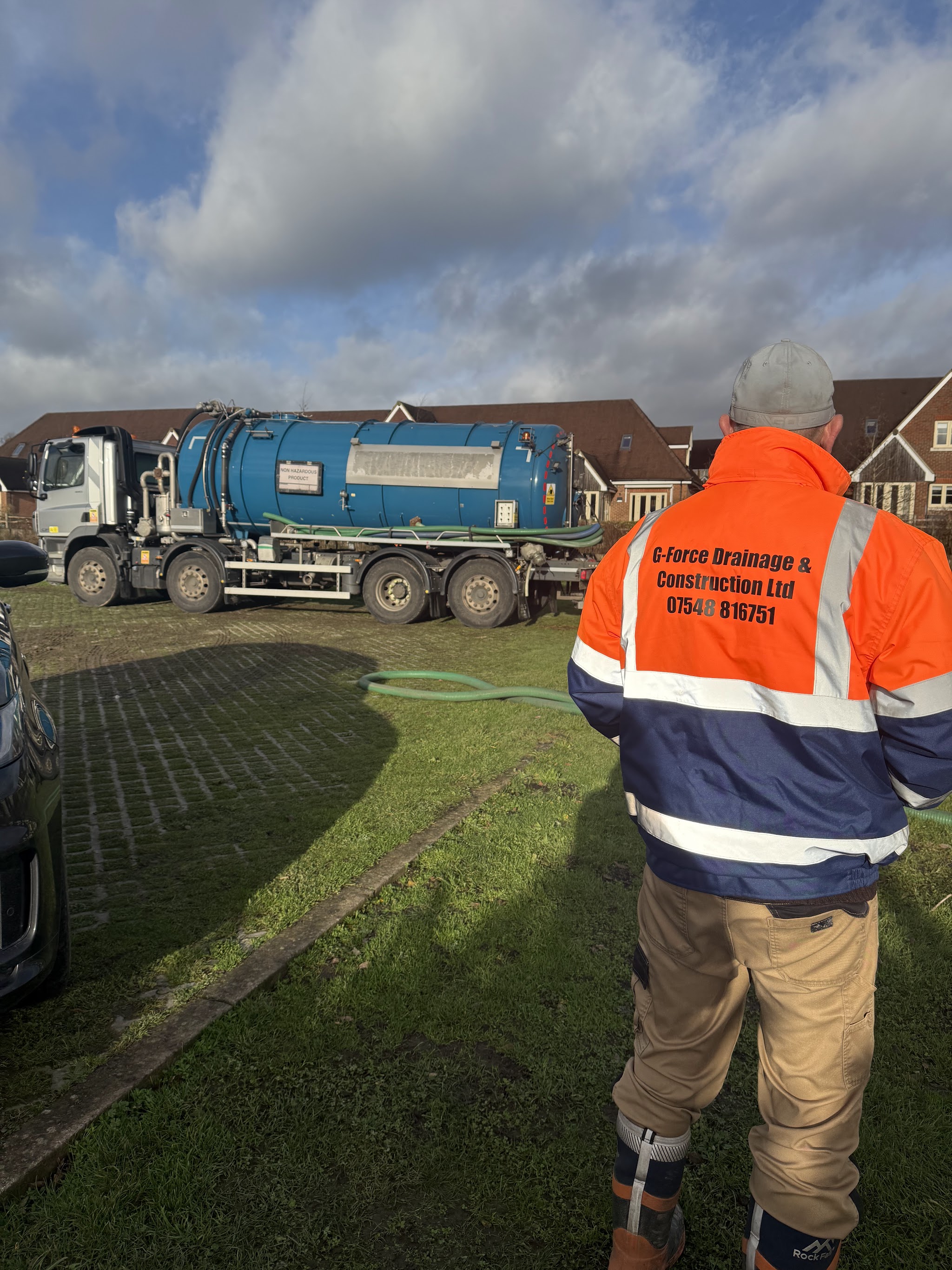 G-Force engineer in branded hi-vis jacket on a job